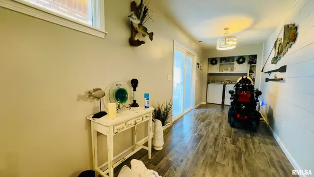 a kitchen with refrigerator and window