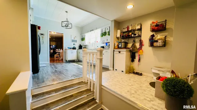 a kitchen with stainless steel appliances a refrigerator sink and cabinets