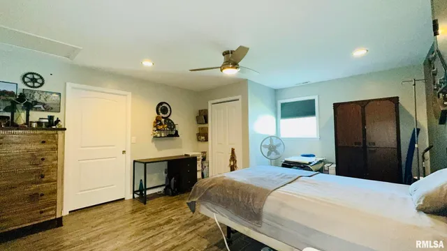 a bathroom with a granite countertop toilet sink and mirror