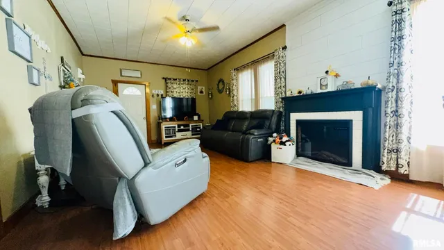 a living room with furniture and a fireplace