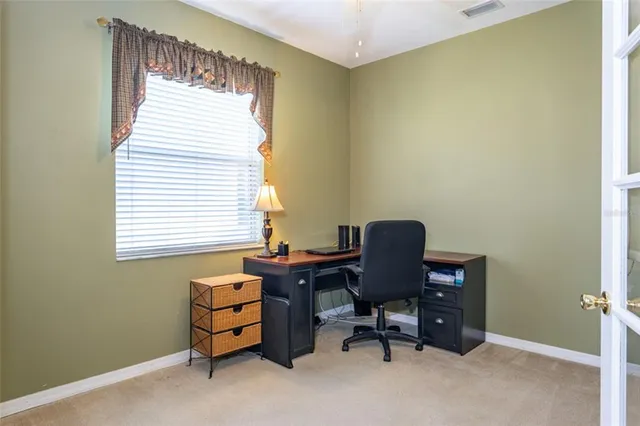 a view of a bedroom with gym equipment