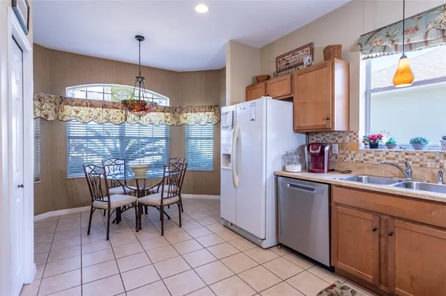 a dining table chair next to a window