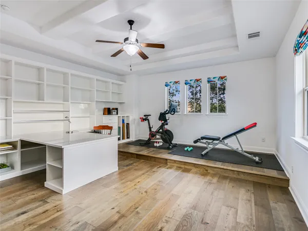 a room with furniture and ceiling fan