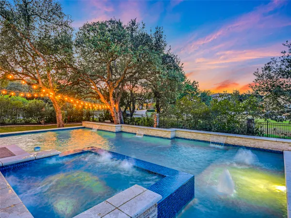 a view of a swimming pool with an outdoor seating