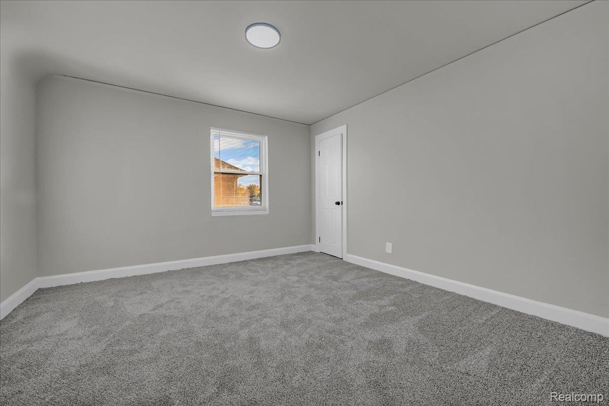 16717 Fielding Street Detroit, MI 48219 - Photo 33 of 46 Spare room featuring carpet and baseboards