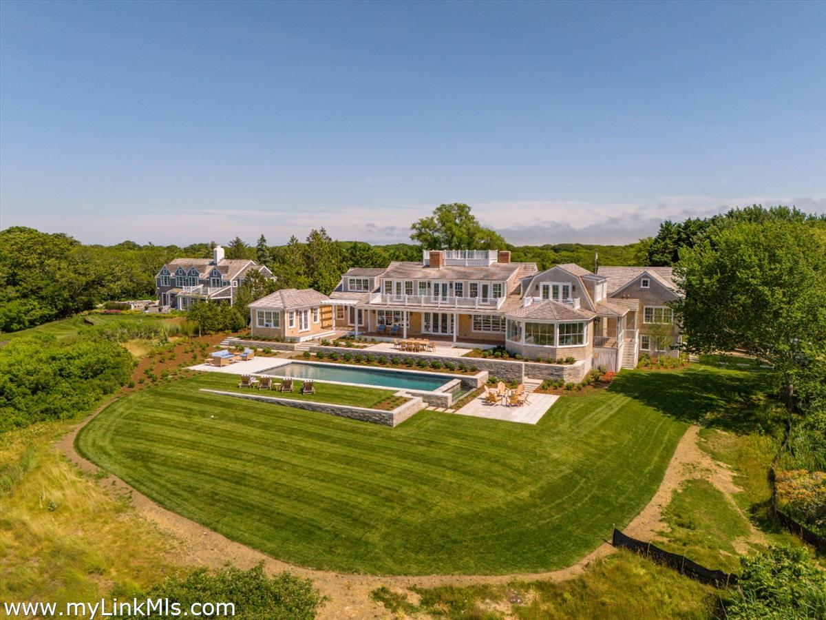 256 Polpis Road Nantucket, MA 02554 - Photo 29 of 30 a view of a swimming pool with a garden