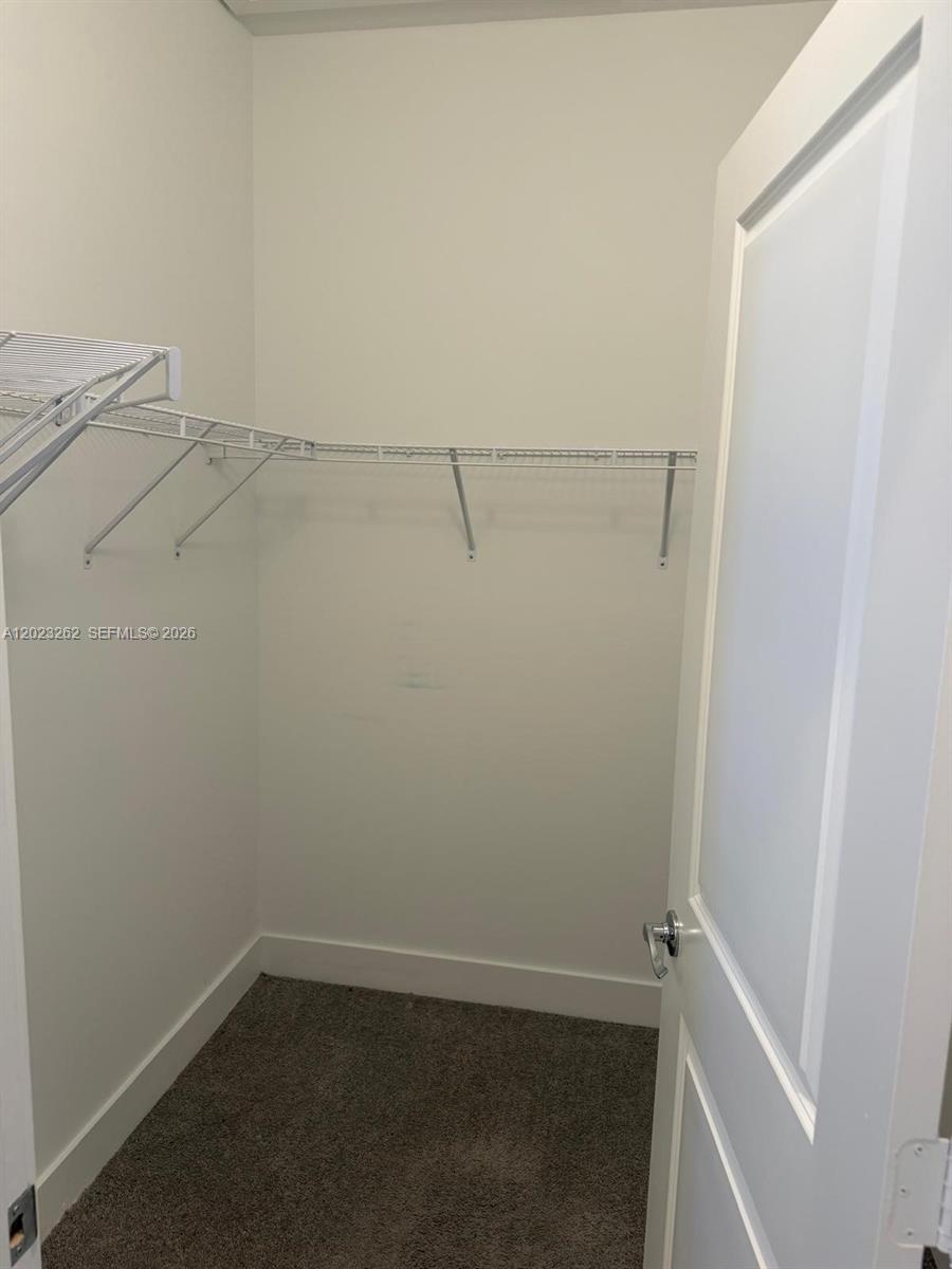 5669 Cerva Lane, Unit 5669 Immokalee, FL 34142 - Photo 16 of 32 a view of small space with racks on the wall