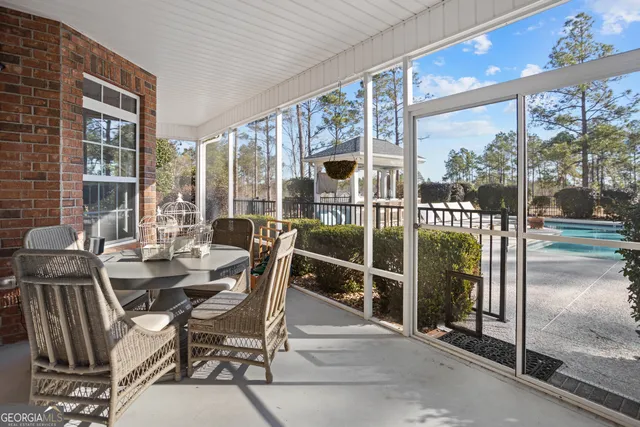 a balcony with furniture and a potted plant