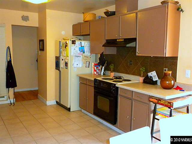 3010 Slater Avenue Reno, NV 89503 - Photo 4 of 9 a kitchen with stainless steel appliances a sink stove and refrigerator