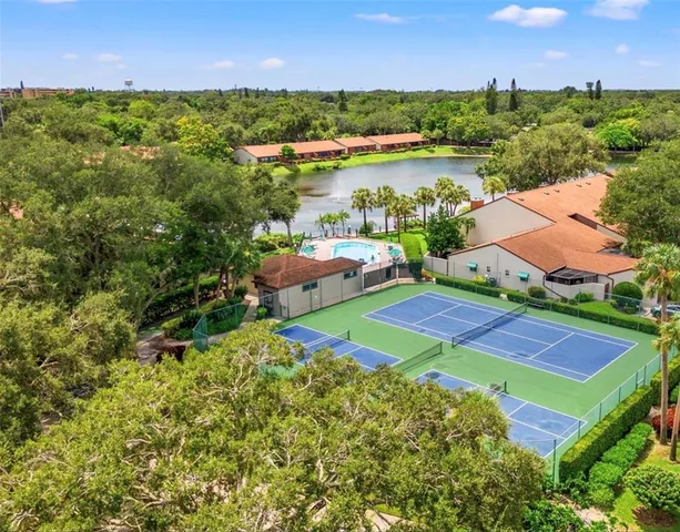 an aerial view of a house with a lake view