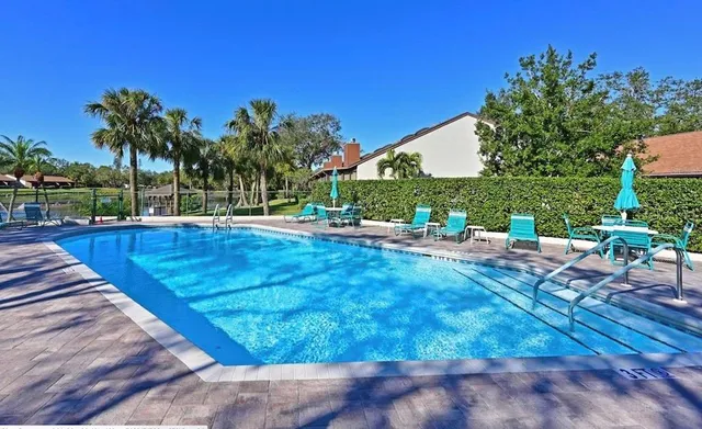 a view of a backyard with sitting area