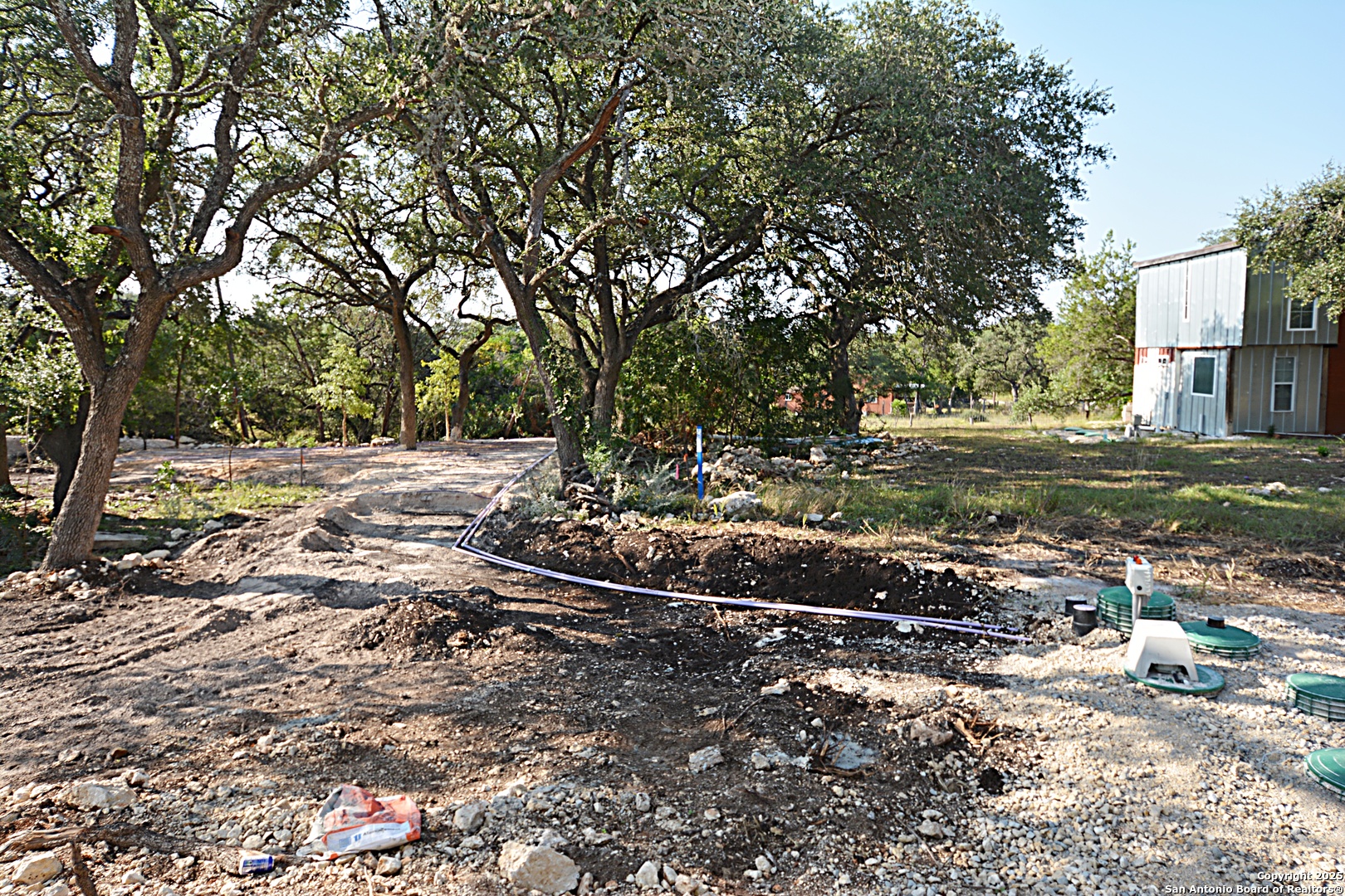 926 High Drive Spring Branch, TX 78070 - Photo 10 of 10 a view of a street with a yard and large trees