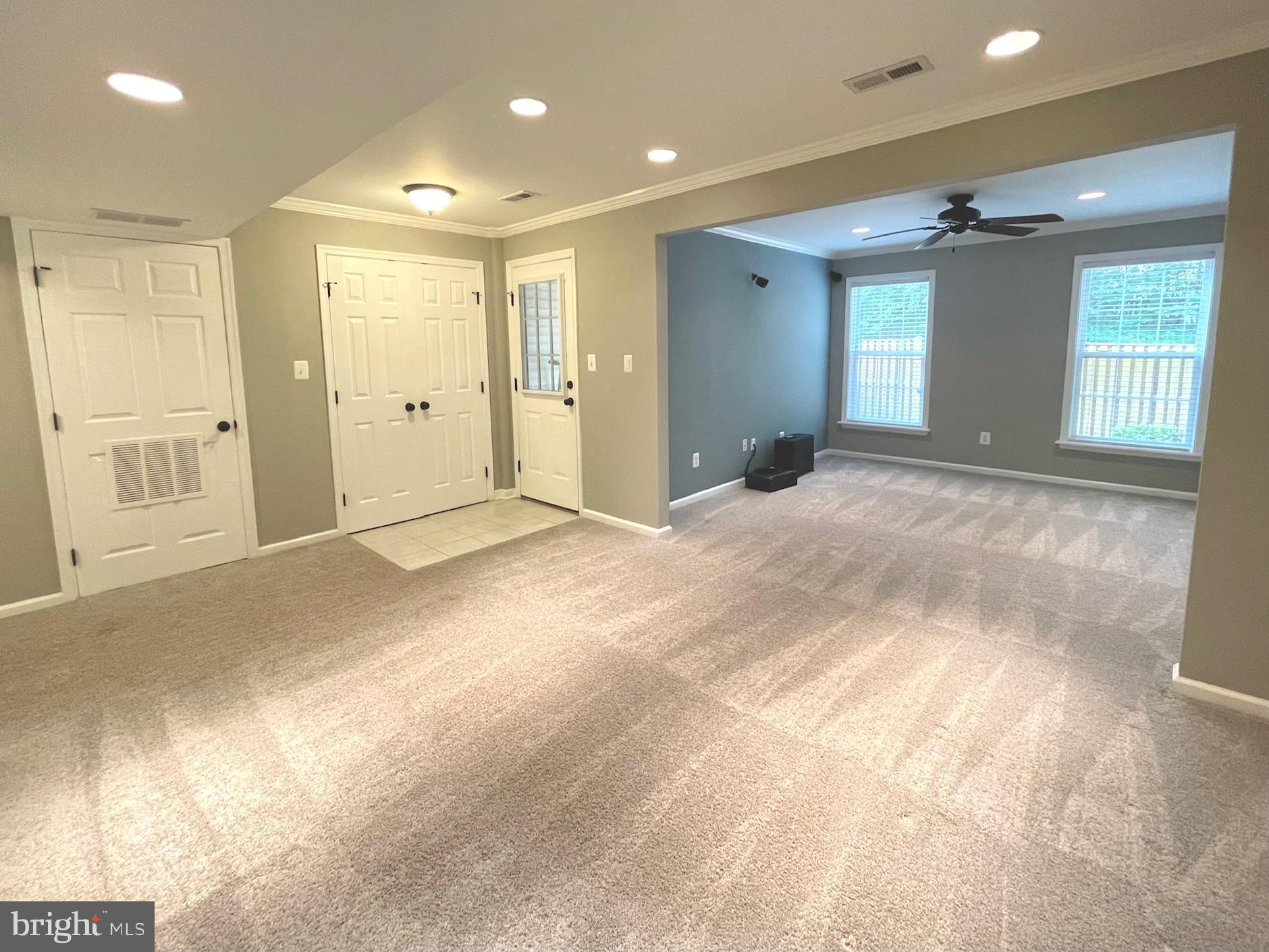 12159 Drum Salute Place Bristow, VA 20136 - Photo 4 of 36 a view of an empty room with window and cabinet