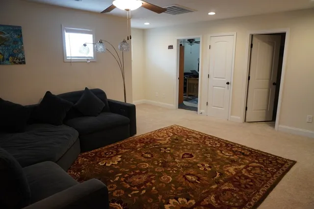 a bedroom with a bed and dresser