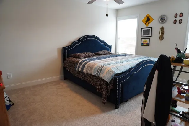a white toilet sitting next to a bathroom sink