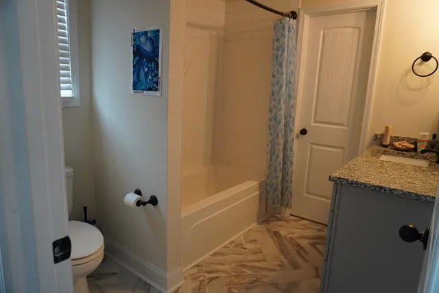 a bedroom with a bed and a table