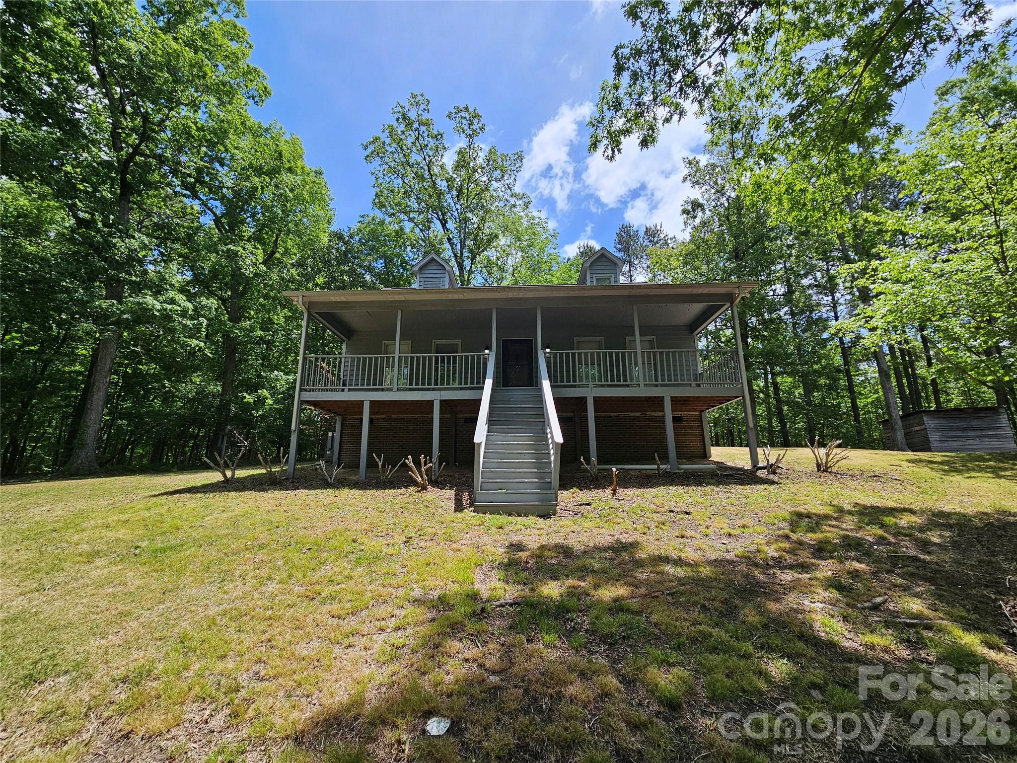 5692 S-141 Great Falls, SC 29055 - Photo 12 of 48 a view of a house with backyard and a tree