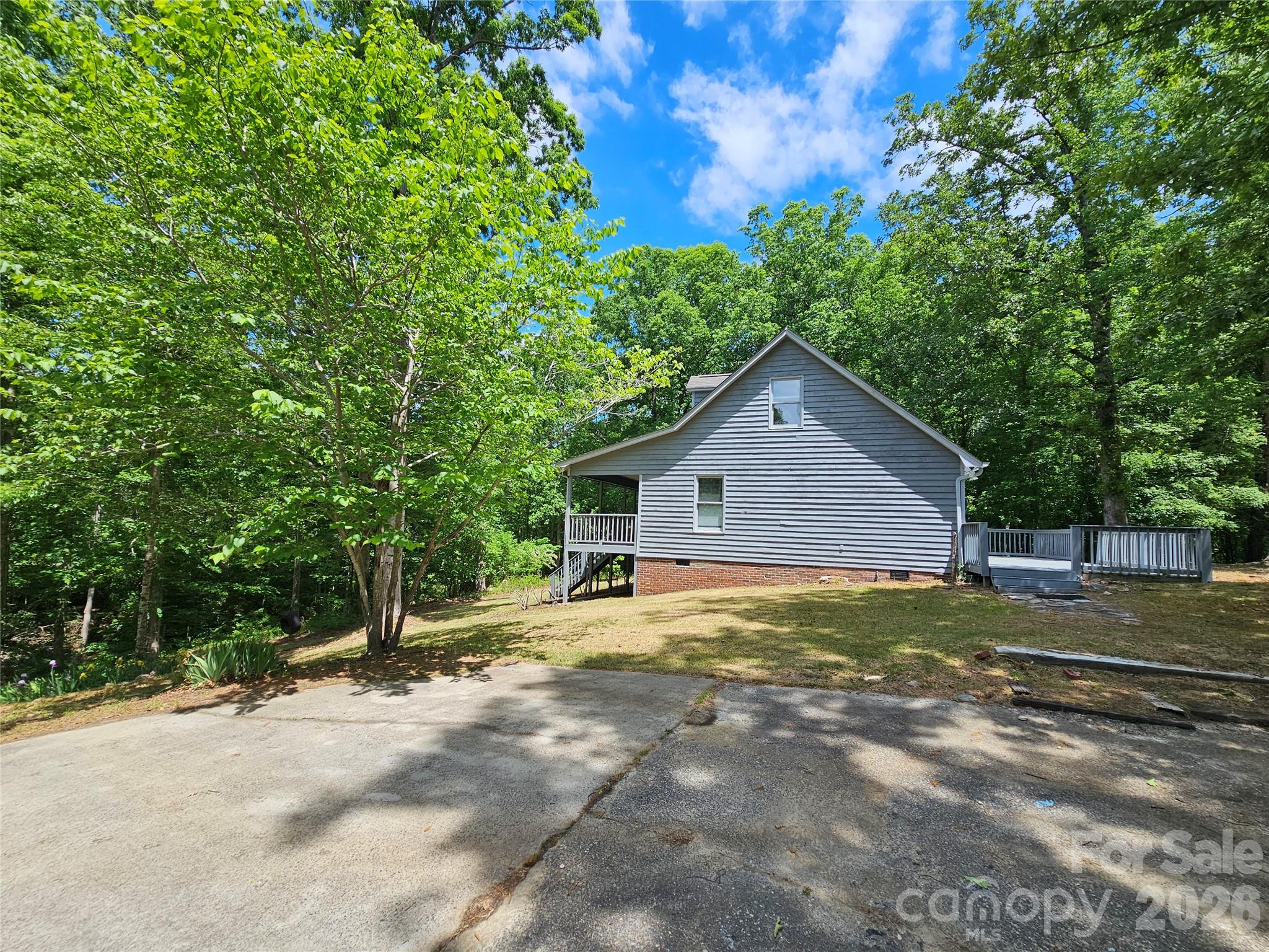 5692 S-141 Great Falls, SC 29055 - Photo 13 of 48 a view of a house with large trees and a small yard