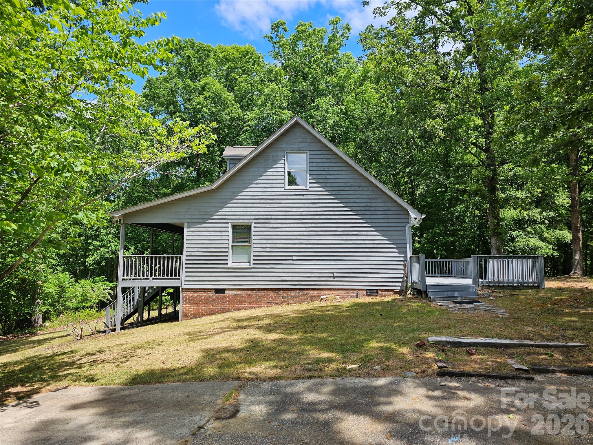 5692 S-141 Great Falls, SC 29055 - Photo 14 of 48 a house view with a garden space