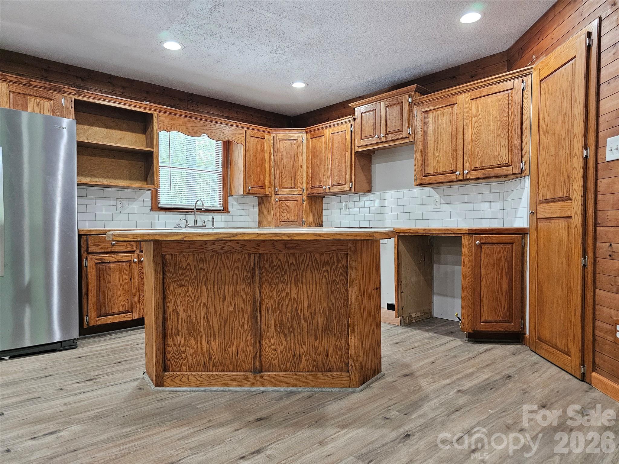 5692 S-141 Great Falls, SC 29055 - Photo 19 of 48 a view of kitchen with stainless steel appliances granite countertop wooden cabinets and a sink