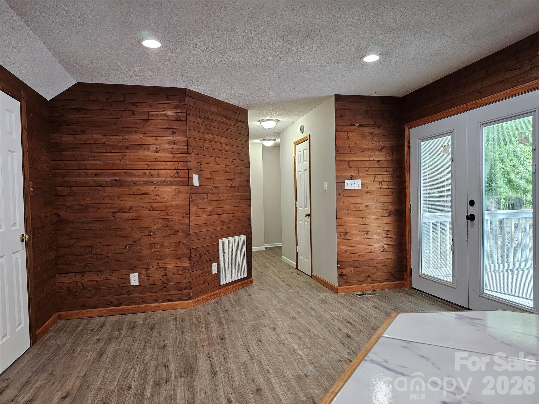 5692 S-141 Great Falls, SC 29055 - Photo 21 of 48 a view of an empty room with wooden floor and a bathroom