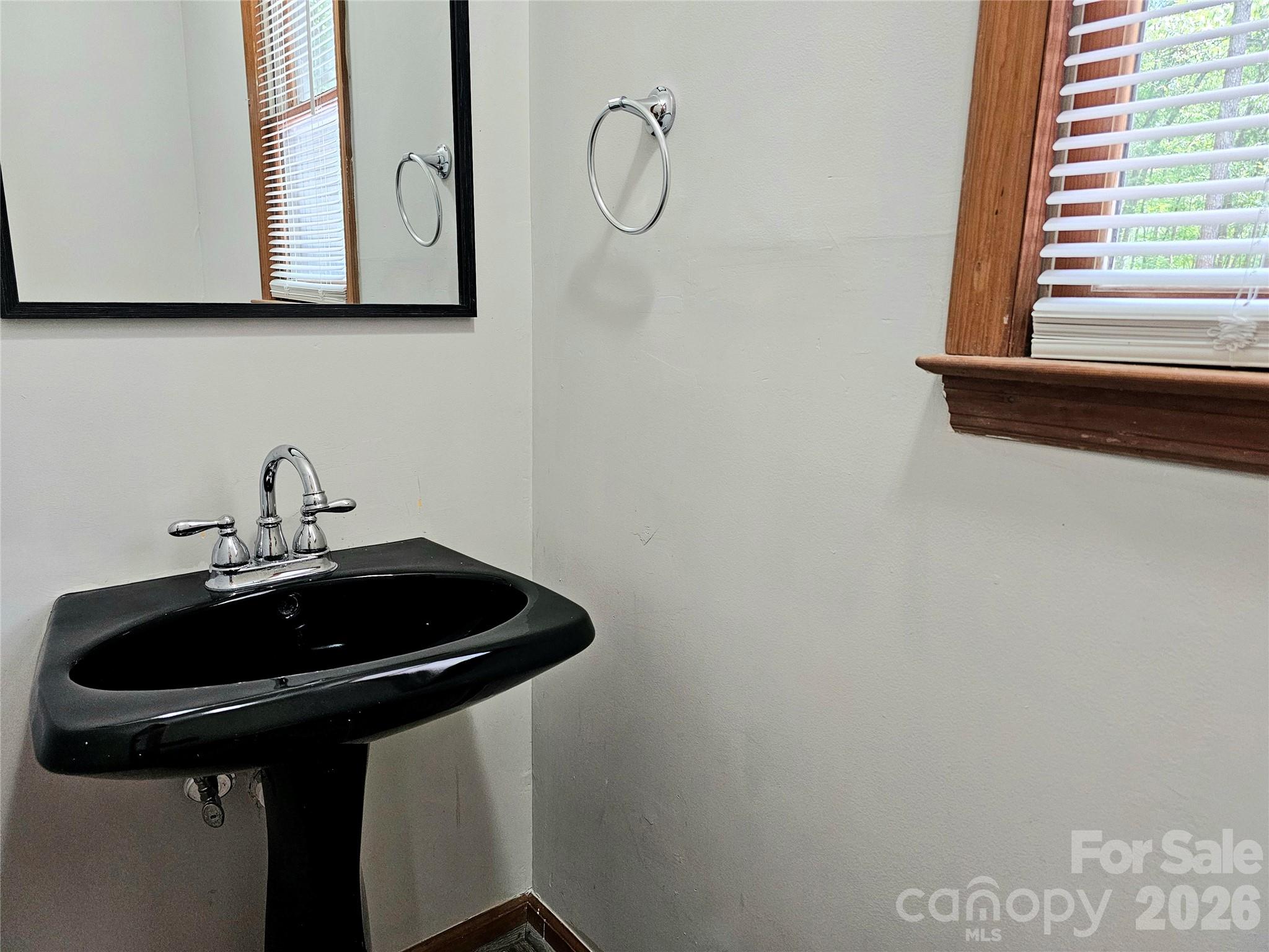5692 S-141 Great Falls, SC 29055 - Photo 22 of 48 a sink and a mirror