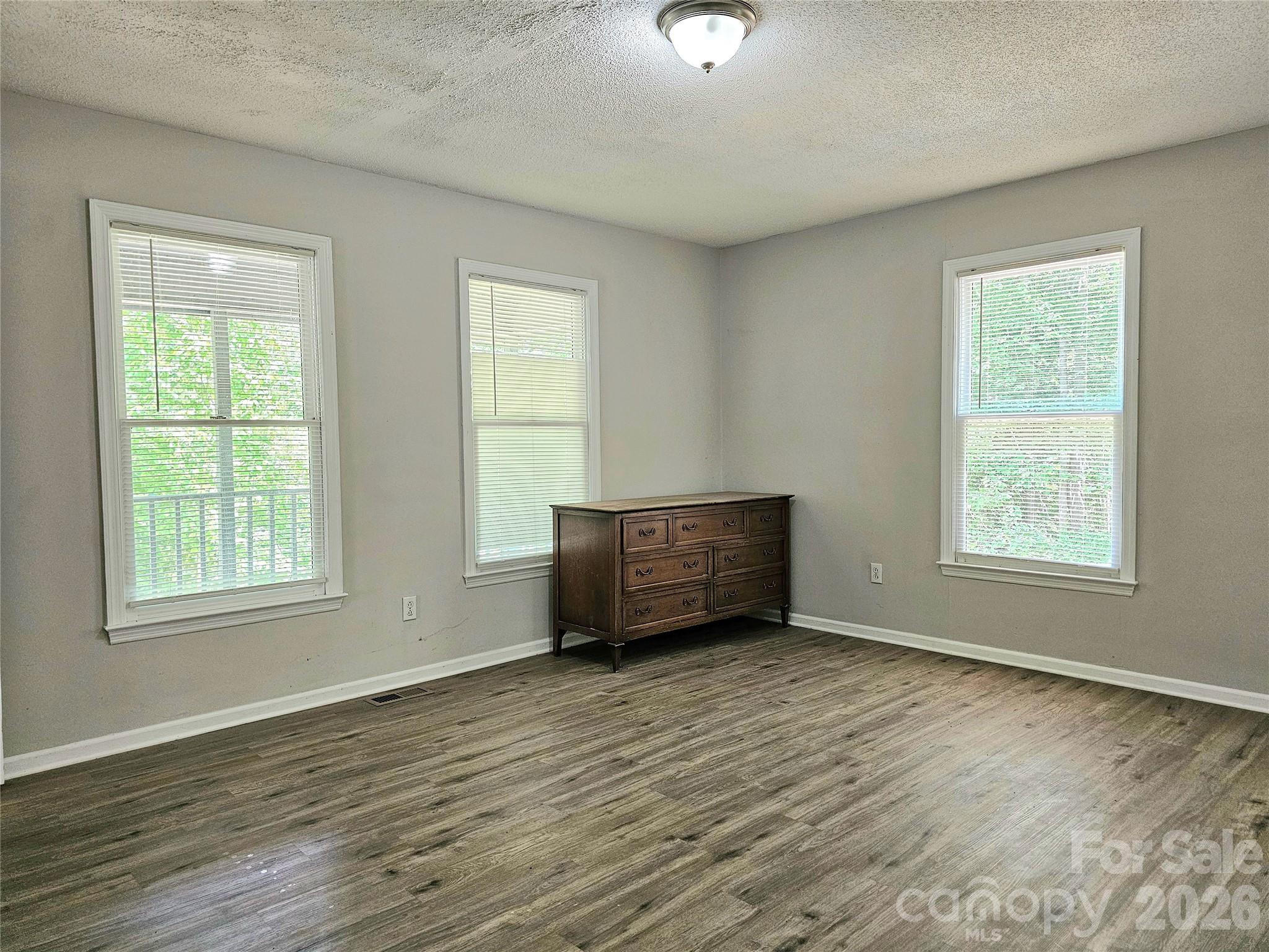 5692 S-141 Great Falls, SC 29055 - Photo 24 of 48 an empty room with wooden floor and windows