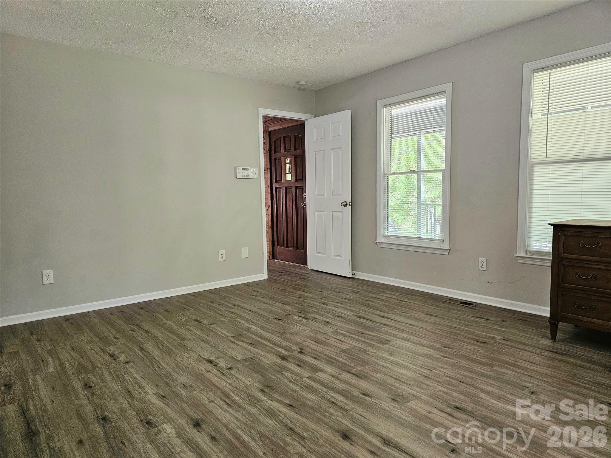 5692 S-141 Great Falls, SC 29055 - Photo 25 of 48 an empty room with wooden floor and windows