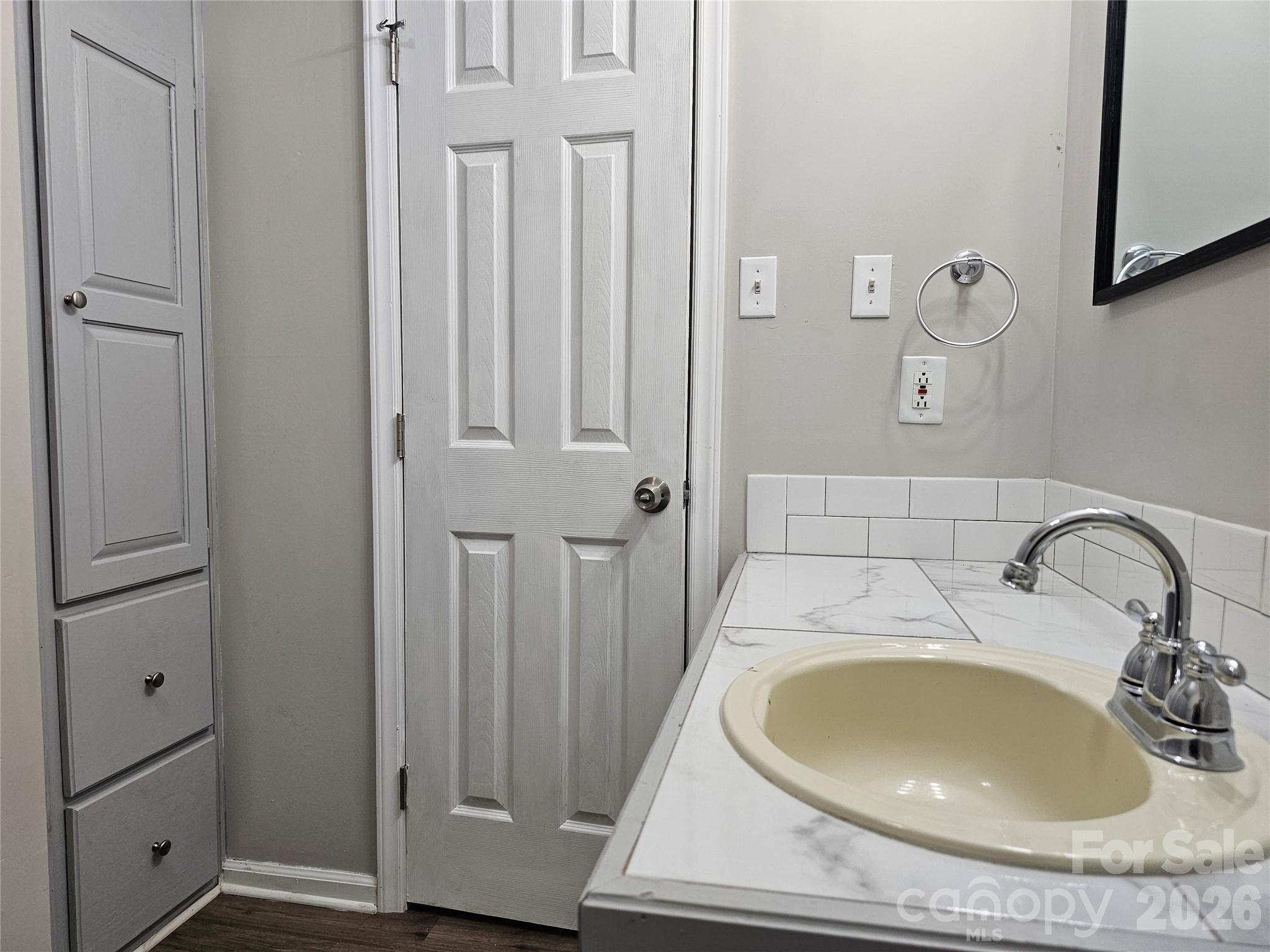 5692 S-141 Great Falls, SC 29055 - Photo 28 of 48 a bathroom with a sink and a mirror
