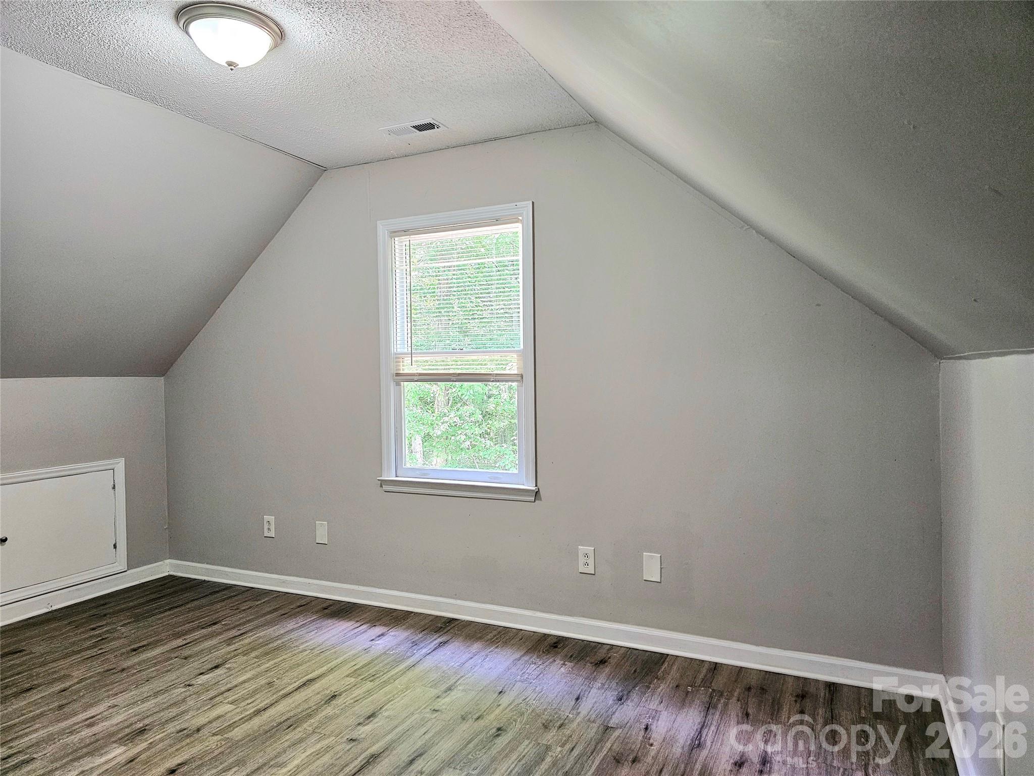 5692 S-141 Great Falls, SC 29055 - Photo 31 of 48 an empty room with wooden floor and windows