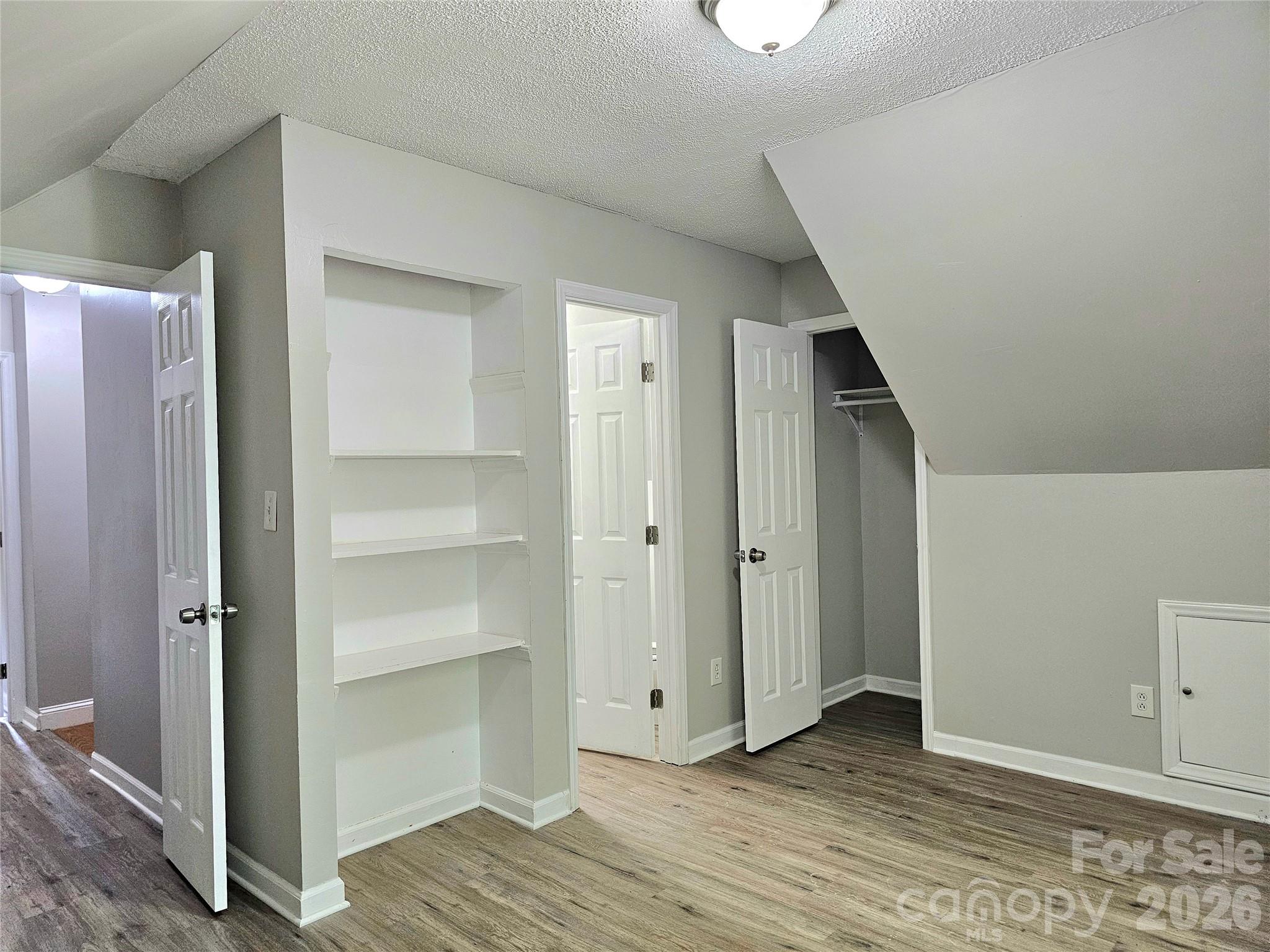 5692 S-141 Great Falls, SC 29055 - Photo 32 of 48 a view of an empty room with wooden floor and closet