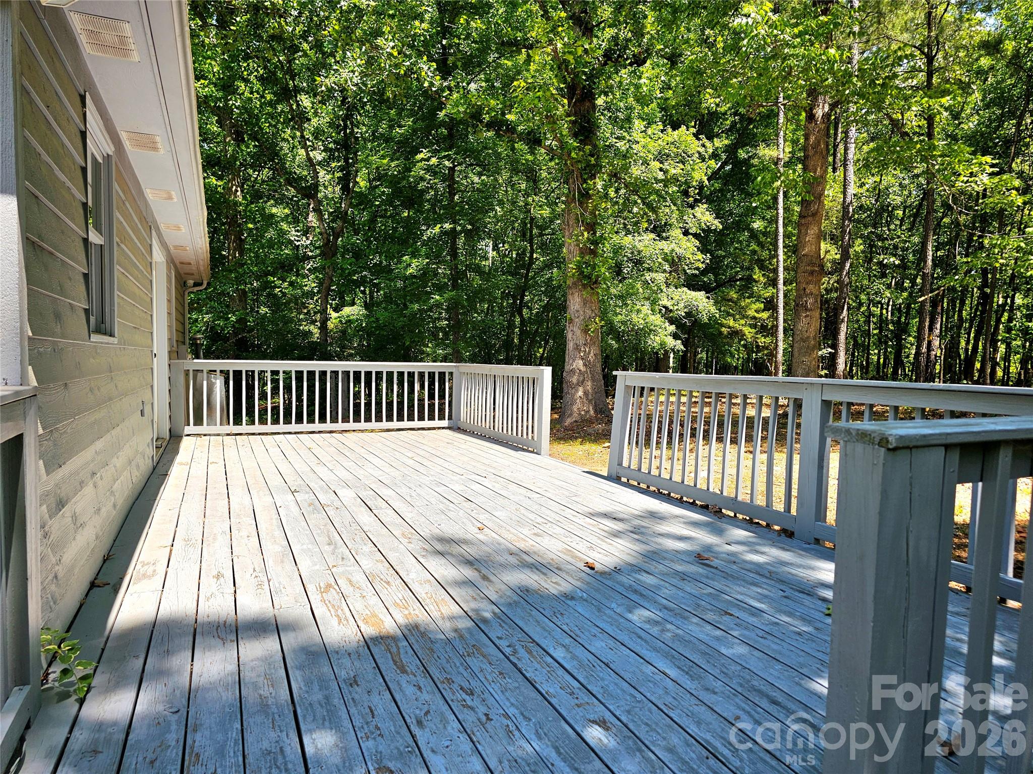 5692 S-141 Great Falls, SC 29055 - Photo 37 of 48 a view of backyard with deck and wooden floor
