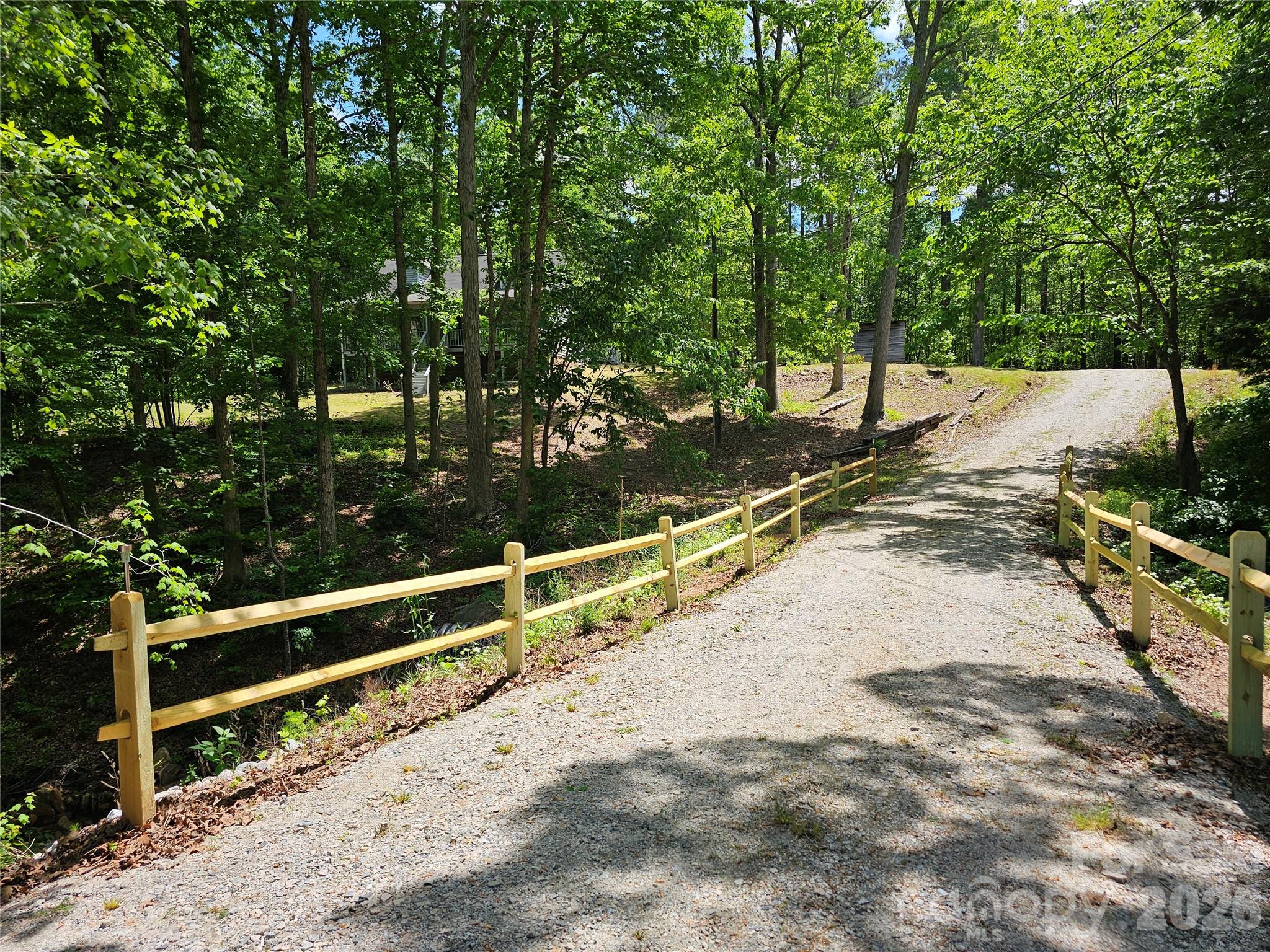5692 S-141 Great Falls, SC 29055 - Photo 6 of 48 a view of a backyard with wooden fence