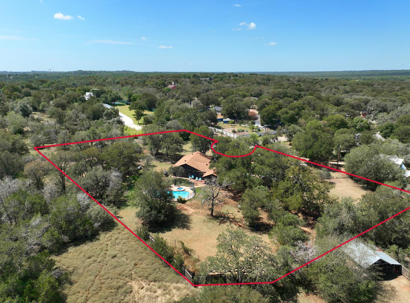 2300 Robin Road Manchaca, TX 78652 - Photo 35 of 36 Mature trees envelope this expansive property featuring a private swimming pool.