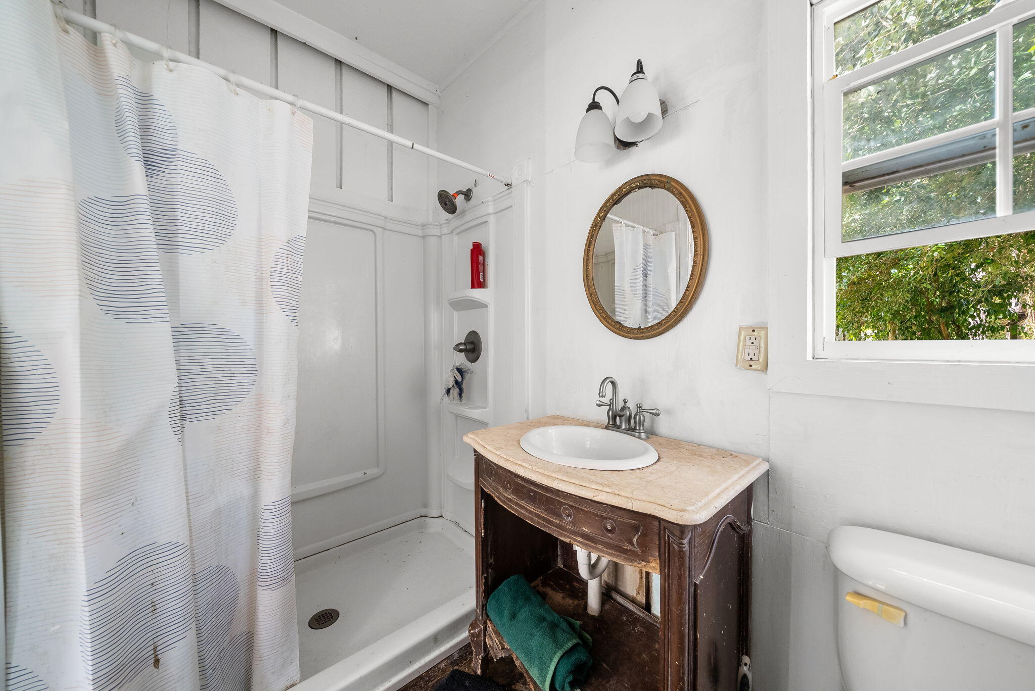 3763 River Ranch Road Vernon, FL 32462 - Photo 45 of 80 a bathroom with a sink a toilet and a mirror