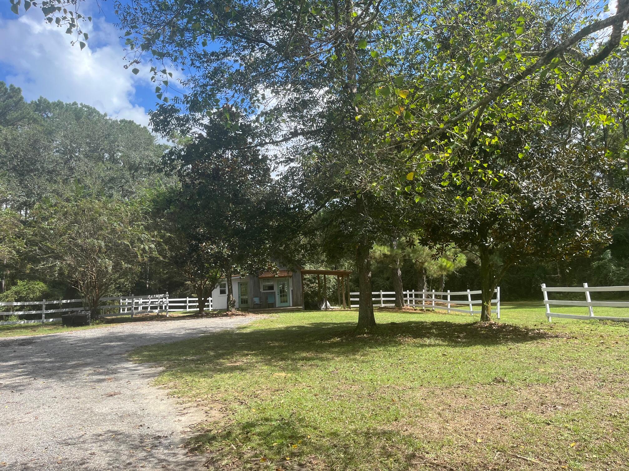 3763 River Ranch Road Vernon, FL 32462 - Photo 70 of 80 a front view of a house with a yard