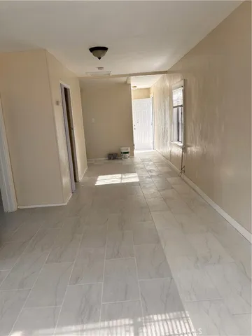 a view of empty room with windows