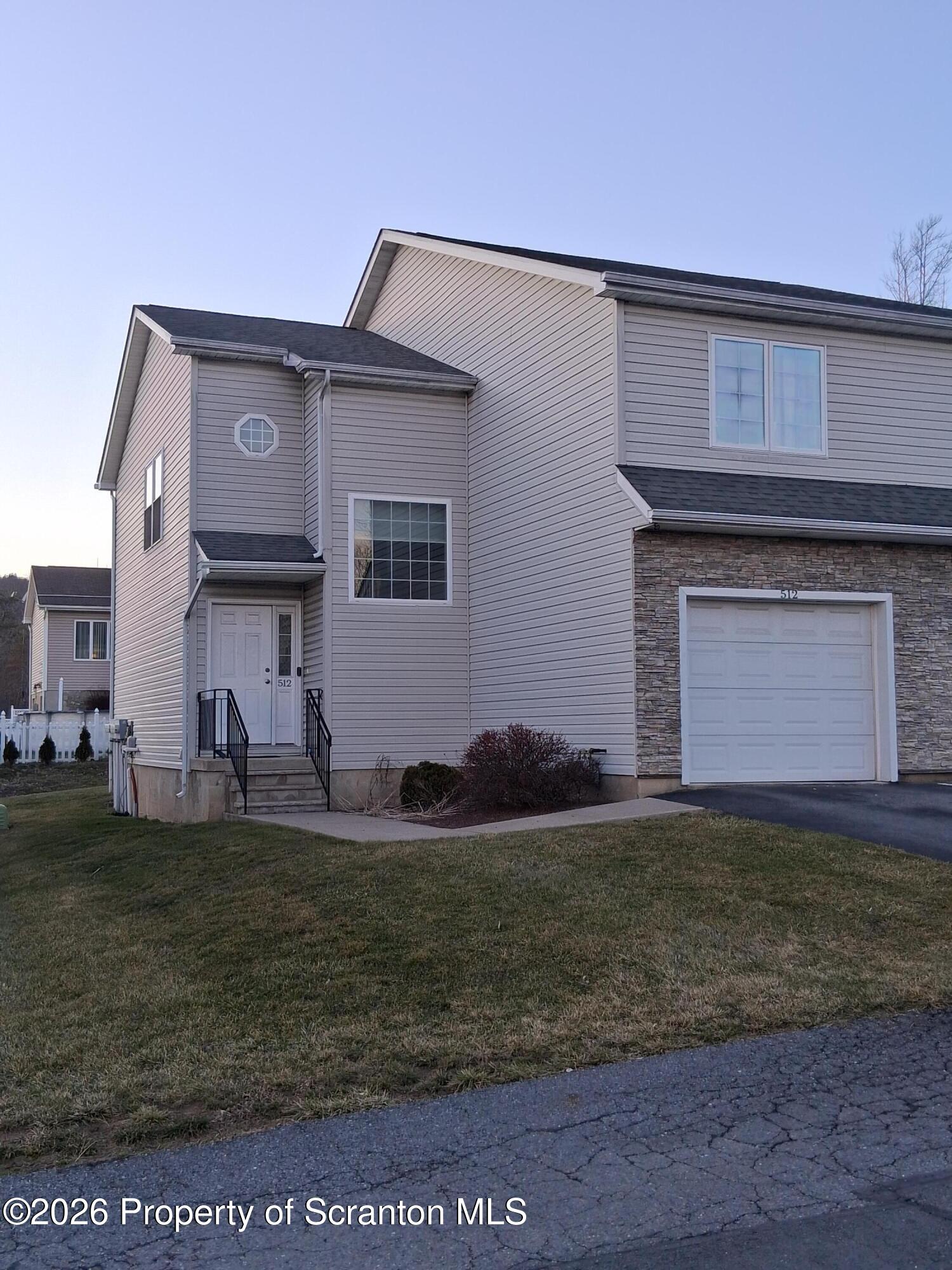512 South Keyser Avenue Scranton, PA 18504 - Photo 1 of 42 a front view of a house with a yard