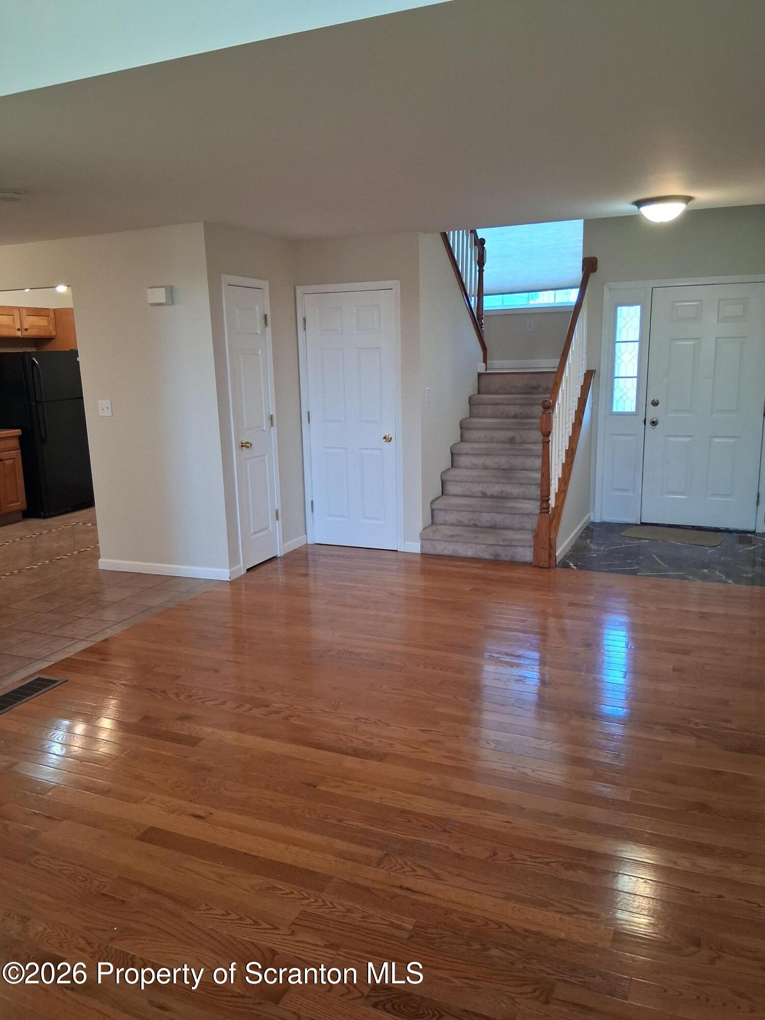 512 South Keyser Avenue Scranton, PA 18504 - Photo 16 of 42 a view of a hallway with wooden floor