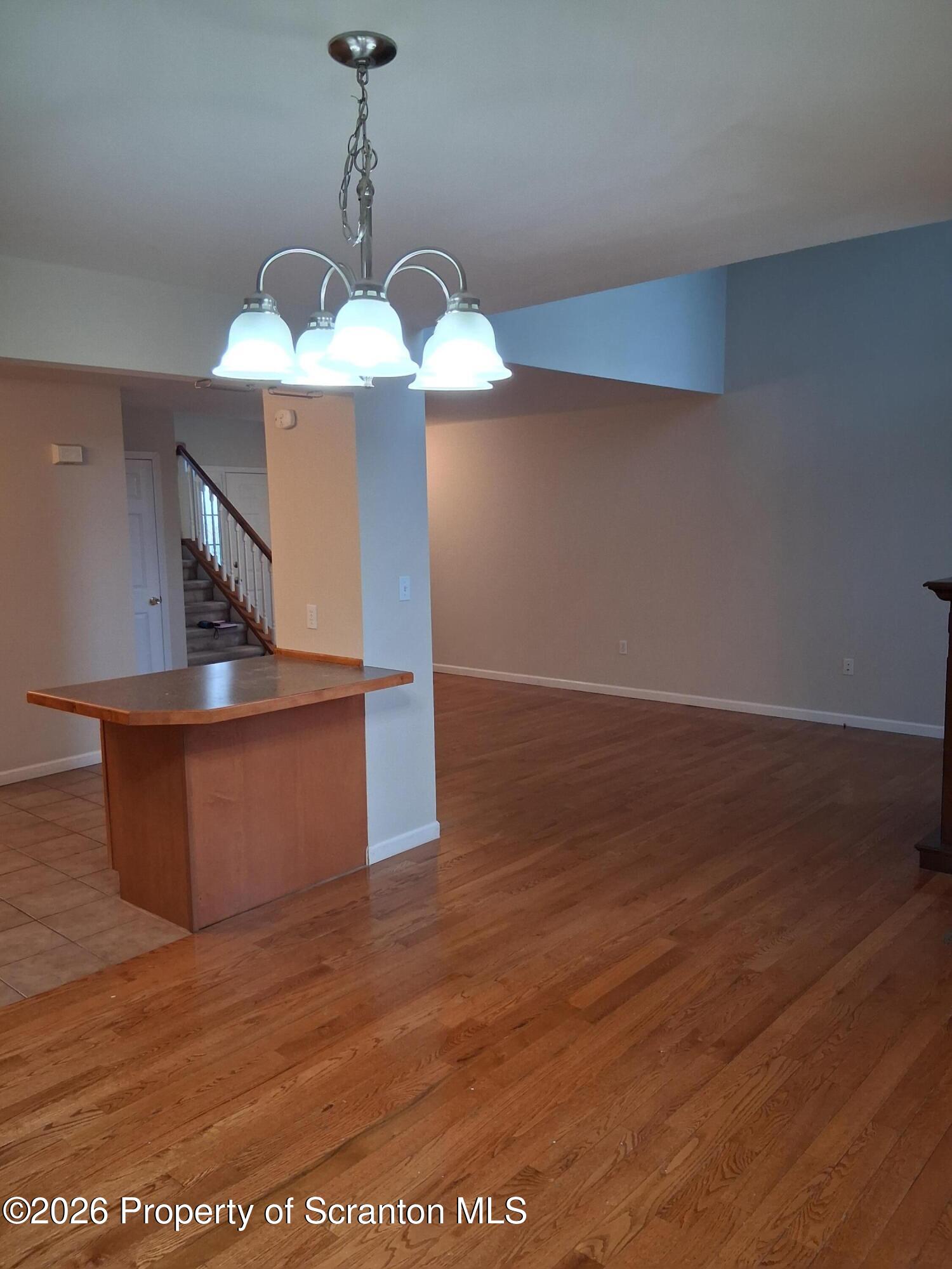 512 South Keyser Avenue Scranton, PA 18504 - Photo 17 of 42 a view of a room with an empty space and a ceiling fan