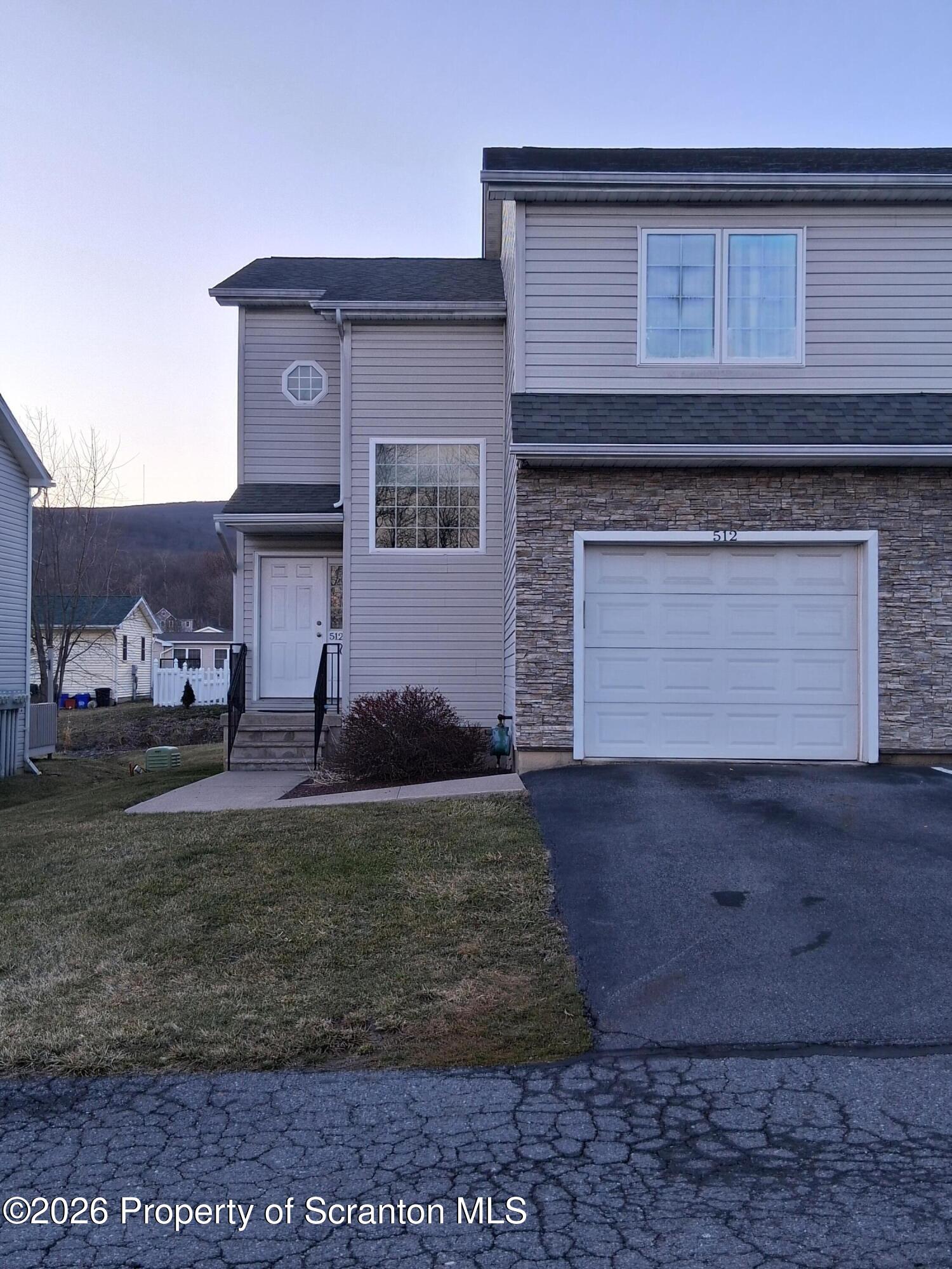 512 South Keyser Avenue Scranton, PA 18504 - Photo 2 of 42 a front view of a house with garden