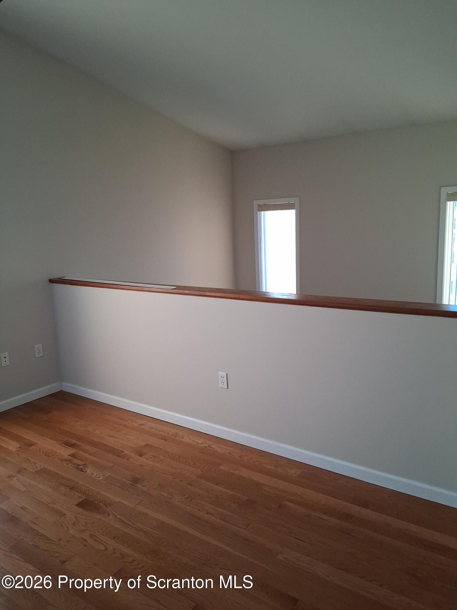 512 South Keyser Avenue Scranton, PA 18504 - Photo 25 of 42 an empty room with wooden floor and windows