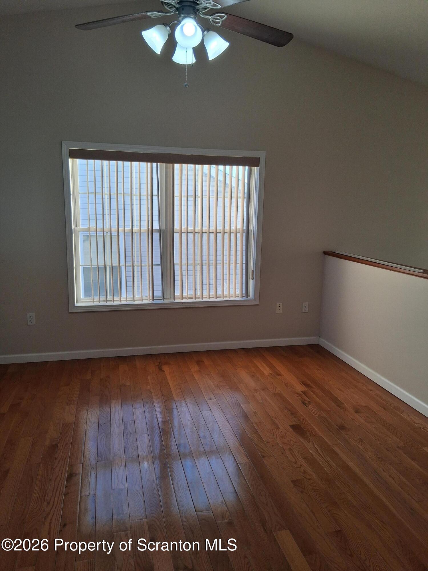 512 South Keyser Avenue Scranton, PA 18504 - Photo 26 of 42 an empty room with wooden floor and windows