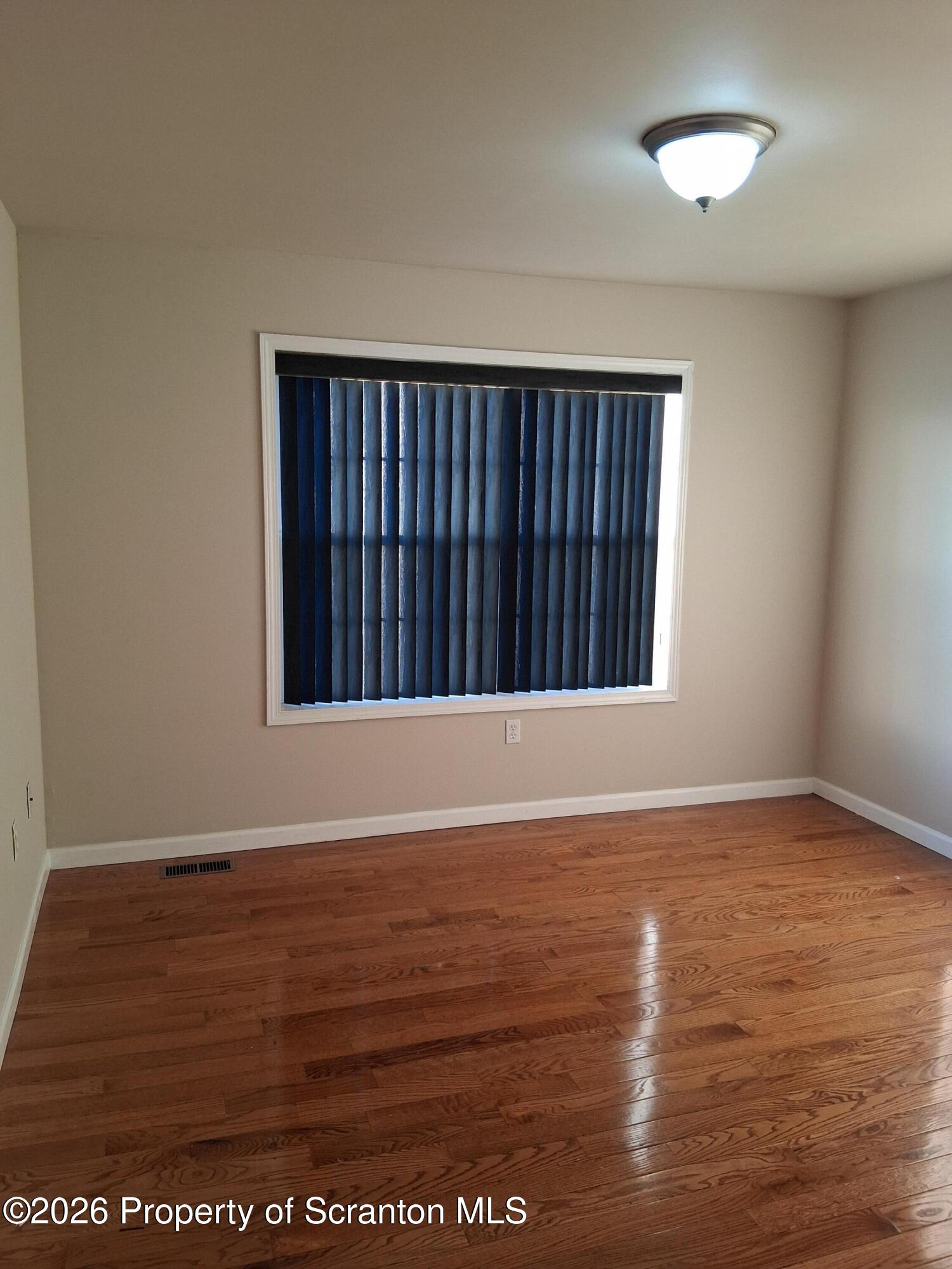 512 South Keyser Avenue Scranton, PA 18504 - Photo 31 of 42 an empty room with wooden floor