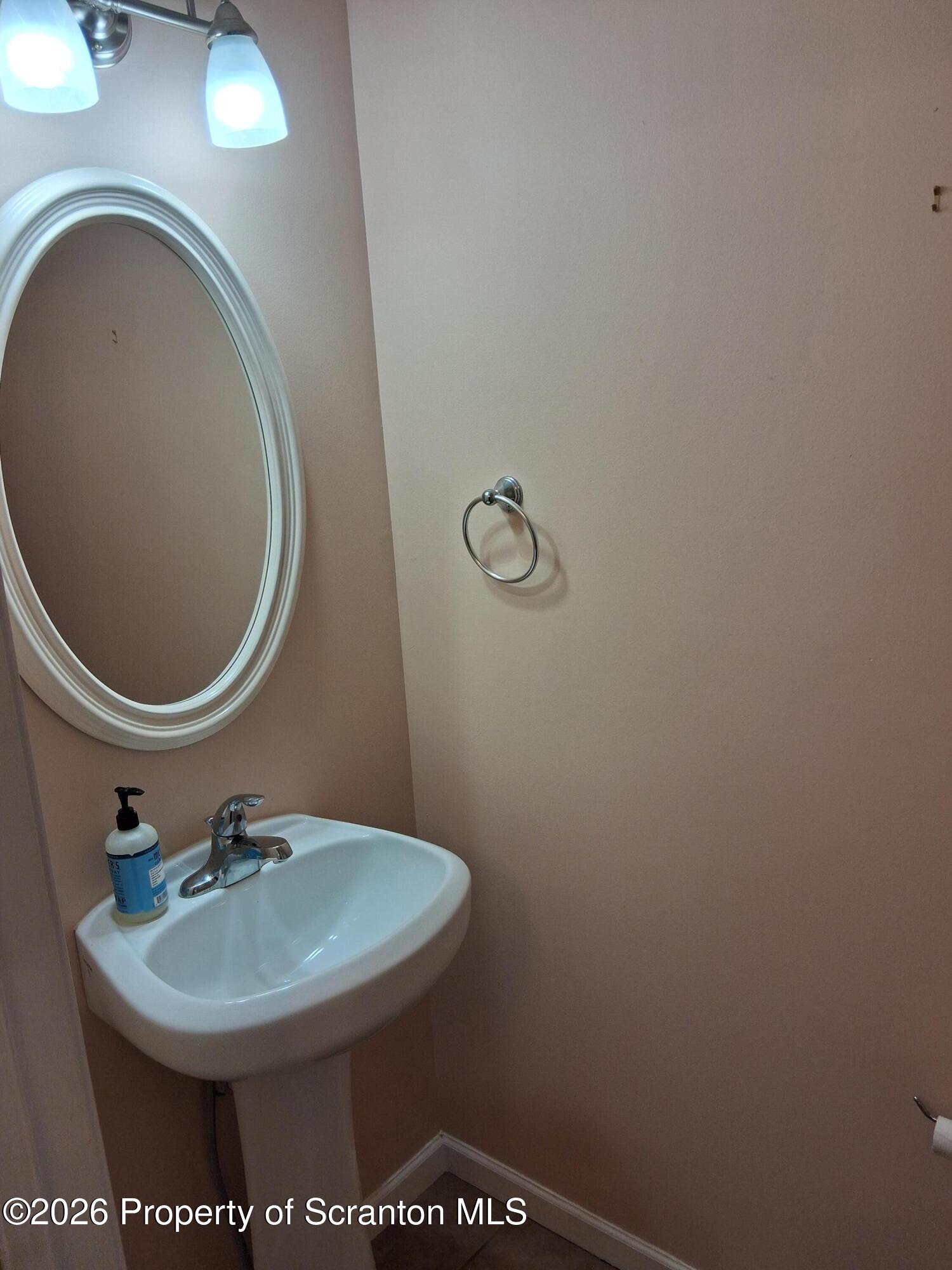 512 South Keyser Avenue Scranton, PA 18504 - Photo 35 of 42 a bathroom with a sink and a mirror