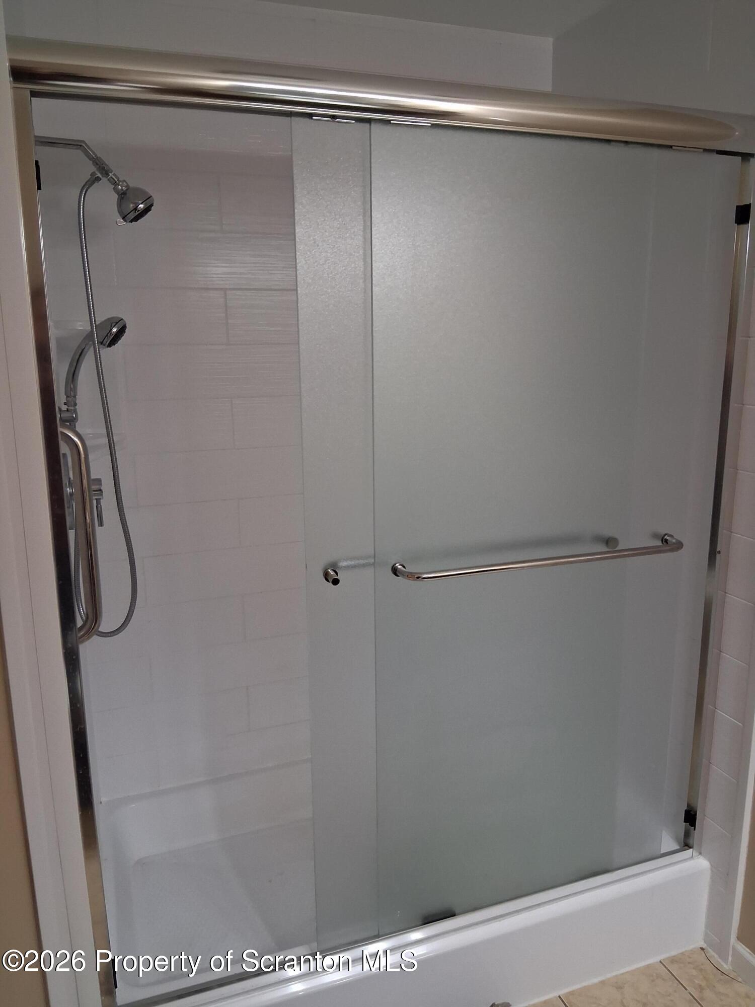 512 South Keyser Avenue Scranton, PA 18504 - Photo 37 of 42 a bathroom with a glass shower door