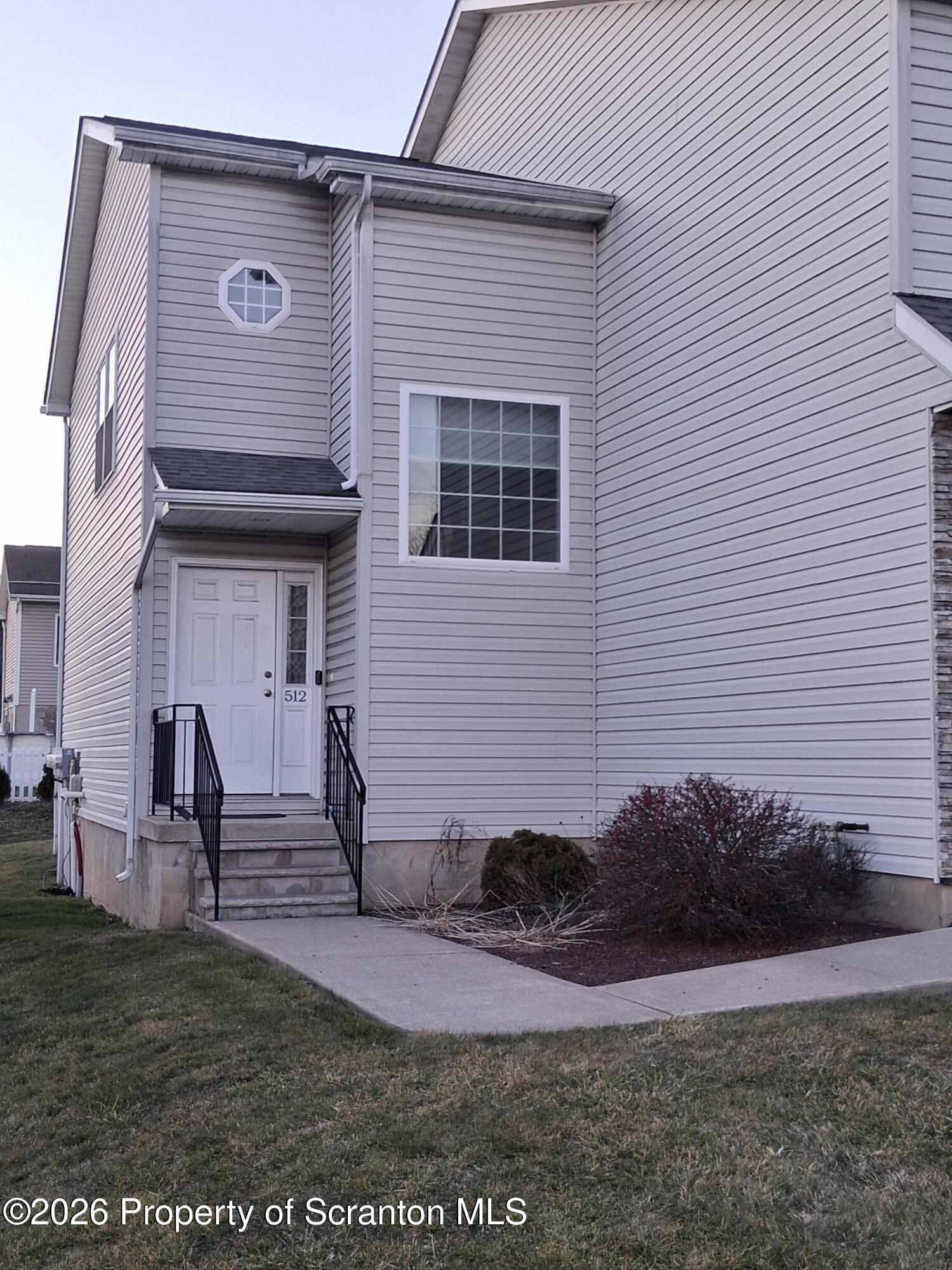 512 South Keyser Avenue Scranton, PA 18504 - Photo 4 of 42 a front view of a house with entertaining space