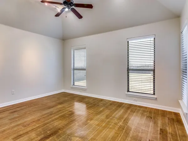 a view of an empty room and a window