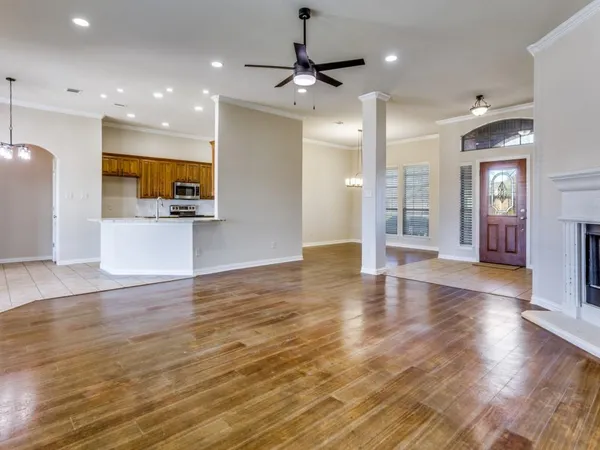 a view of kitchen with cabinets and wooden floor