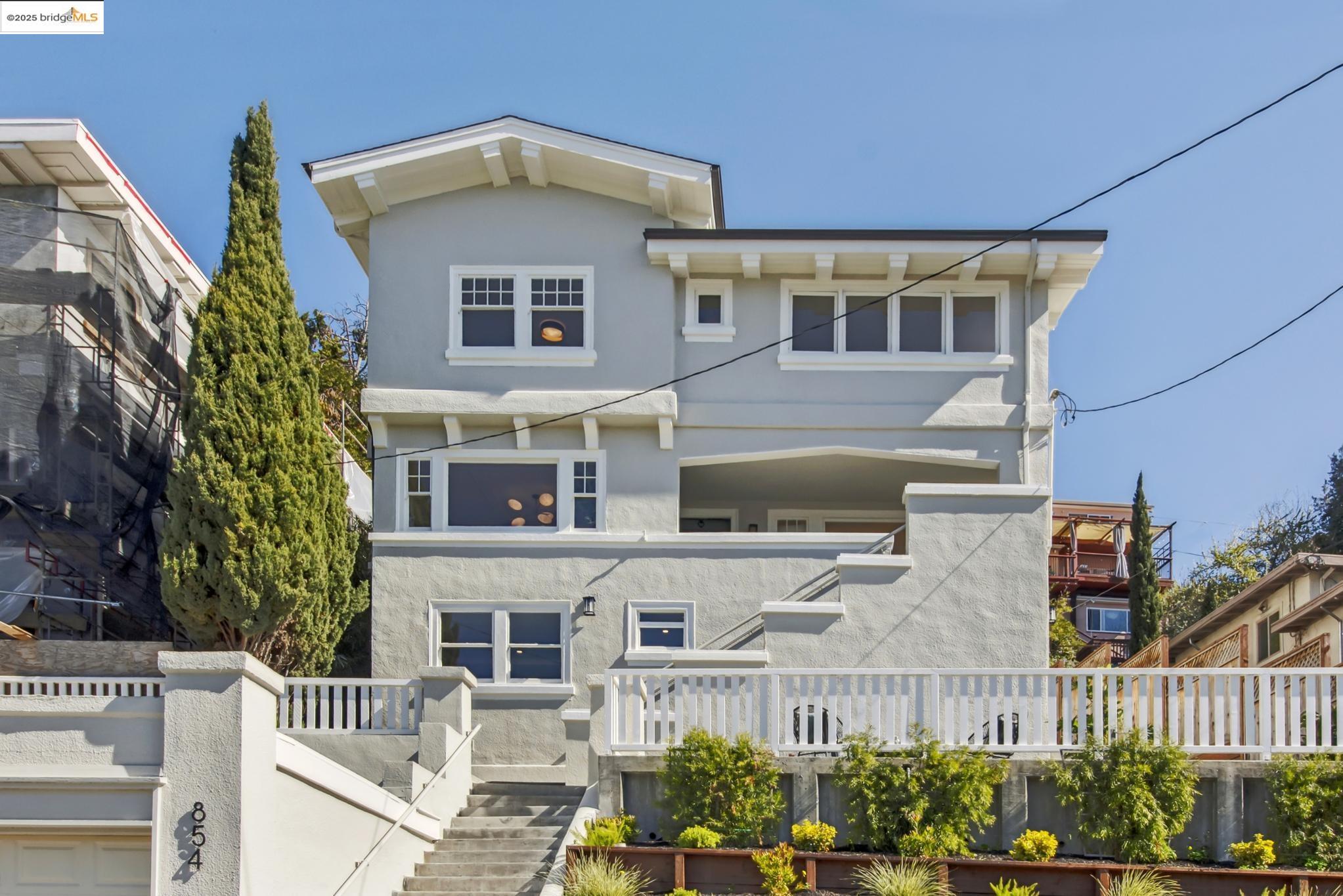854 Walker Avenue Oakland, CA 94610 - Photo 1 of 1 a front view of a house with a garden